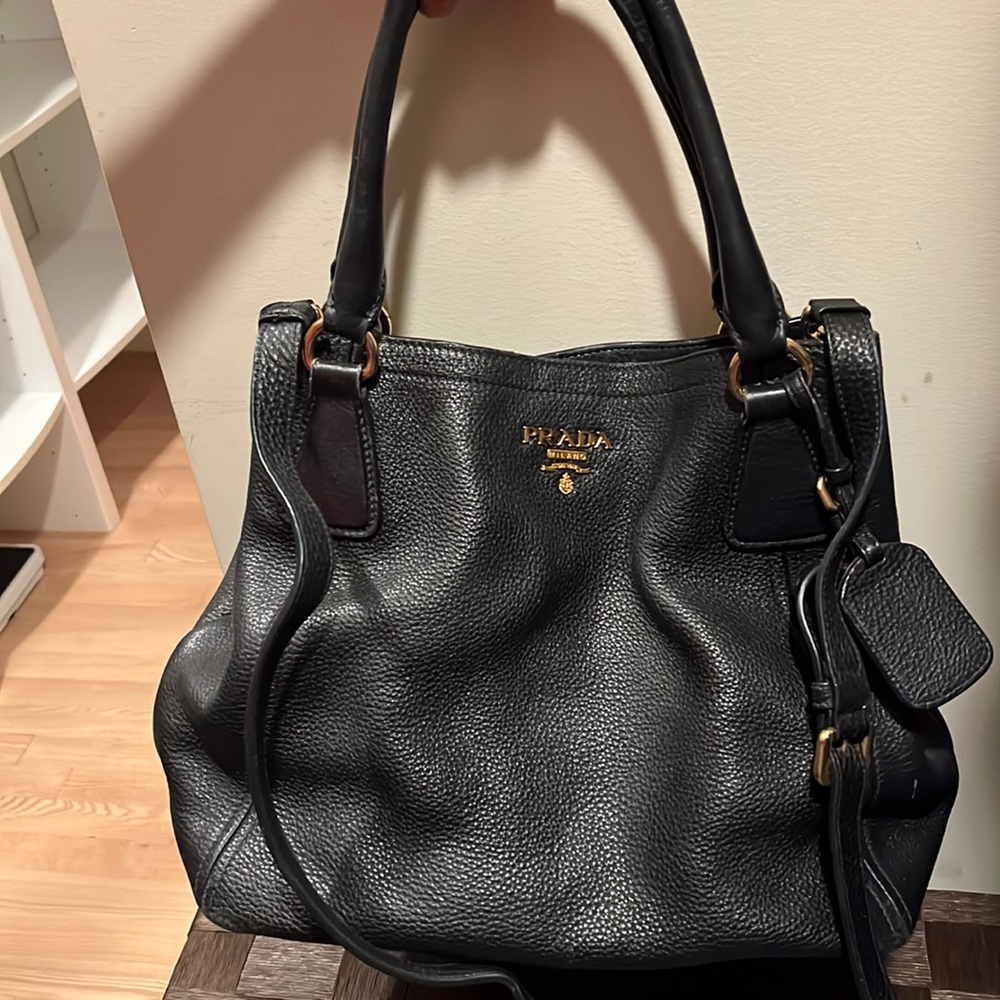 Prada purse with two straps. Light signs of wear. Lots of space!